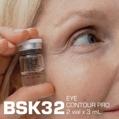 BSK32 Eye Contour Pro serum vial held near eye, 3mL anti-aging eye care treatment